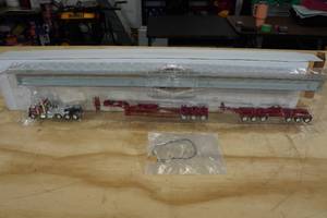 lot 148 image: Ertl Peterbilt 389 Day Cab Tri-Axle Truck with Trailers 164 Scale Replica