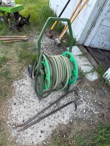 lot 91 image: Hose & Reels & Pry Bars