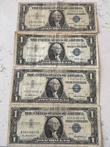 lot 25 image: 1957 Blue Seal $1 Dollar Silver Certificates