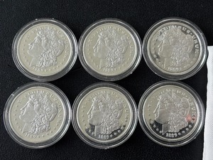 lot 102 image: Replica Morgan Dollars