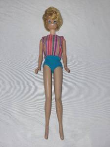 lot 107G image: Pair of Vintage Barbie Dolls in Original Swimsuits