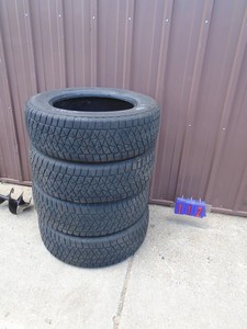 Bridgestone Blizzak P245/65R18 tires. Used condition. Approx ½ tread left. As shown.