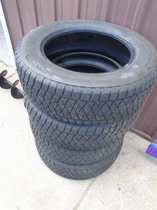 Bridgestone Blizzak P245/65R18 tires. Used condition. Approx ½ tread left. As shown.