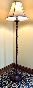 lot 25 image: Elegant Floor Lamp with Beige Fabric Shade and Bronze Finish