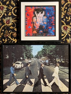 lot 66 image: Paul McCartney Tug Of War Album Art and The Beatles Abbey Road Puzzle Framed Set