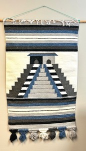 lot 70 image: Handwoven Tapestry with Pyramid Design and Tassel Accents