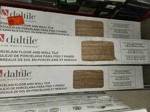 lot 28 image: 10 boxes Golden brown 6x36 porcelain tile