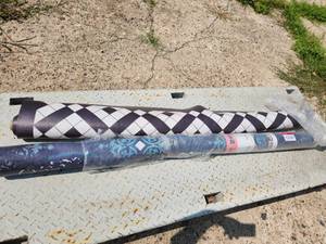 lot 52 image: 2 5x7 vinyl area rugs