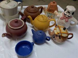 lot 176 image: Teapots...