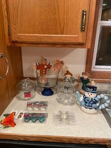 lot 49 image: Holiday and Fall-Themed Kitchenware Collection with Jars, Candle Holders, and Decor