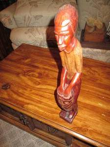 lot 574 image: Hand carved wooden man playing drum...