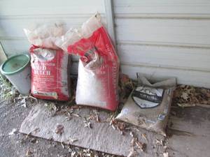 lot 653 image: (2) bags of red tone wood landscapi...
