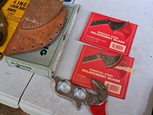 lot 517 image: Wyoming Knife Dressing Knife, Leather Sheath and Extra Blades