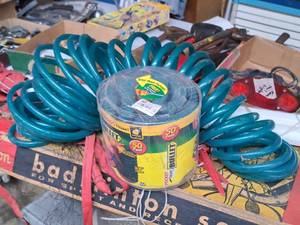 lot 557 image: Coil Hose and Bullet Pocket Hose