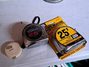 lot 719 image: Lot of (3) Assorted Tape Measures - Tool Shop 25 (new), Tool Shop 25 (used) and One Unknown