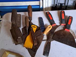 lot 724 image: Lot of (12) Assorted MasonryDrywall Tools and Scrapers