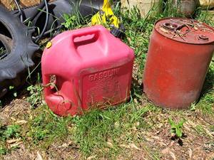 lot 801 image: Lot of (2) 5-Gallon Gasoline Cans - (1) Metal, (1) Plastic