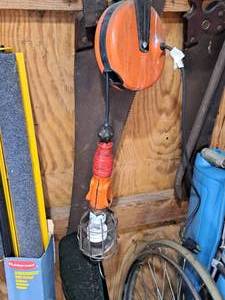 lot 858 image: Hand Saw and Work Light on Reel