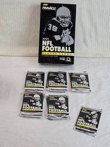 lot 42 image: Lot of 11 Unopened packs of 1991 NFL Football Player CardsScore Pinnacle Premier Edition