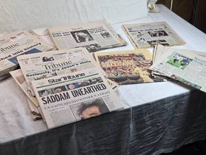 lot 61 image: Lot of Vintage Newspapers Featuring Historic Headlines - Saddam, Cubs Win, John Glenn, Joe Mauer and More