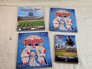 lot 76 image: Lot of Minnesota Twins Team Yearbooks and Information Books from 2010 and 2011