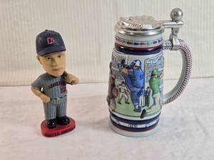 lot 91 image: Lot of Baseball Memorabilia Justin Morneau Bobblehead and Avon Stein