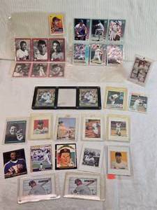 lot 148 image: Assortment of Baseball Trading Cards Featuring Various Players Visible players include Ken Griffey Sr., Greg Maddux, and Don Mattingly among others.