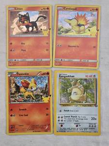 lot 164 image: Lot of Four Pokmon Trading Cards Cyndaquil, Kangaskhan, Litten, and Fennekin.