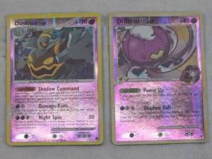 lot 175 image: Lot of Two Holographic Pokemon Trading Cards Dusknoir and Drifblim.