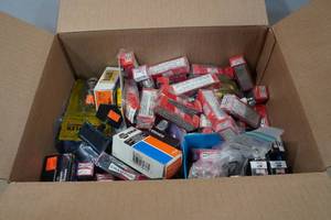 lot 56 image: Assorted Auto Parts - Plugs, Fuses, Muffler Clamps