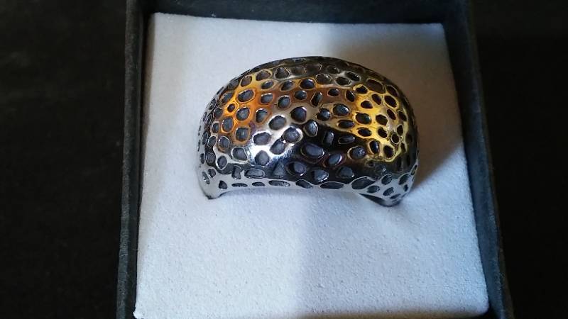 lot 205 image: Silver Colored Ring Band with Wave Design.