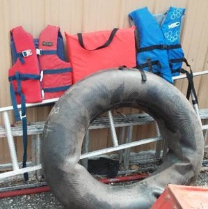 lot 21 image: Lake Tube, life Jackets (2) and flotation Cushion.
