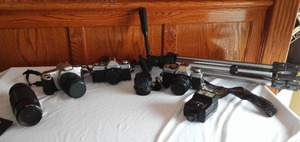 lot 6 image: Minolta (2) and Cannon Camera, Tripod, lenses and more.