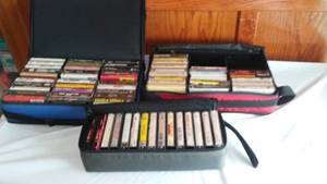 lot 13 image: Cassette Tape Variety with Carry cases (3) Journey, Billy Ray Cyrus, Randy Travis, Joan Jett, Clapton and more.