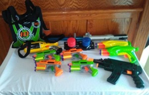 lot 86 image: NERF Maverick REV-6, handhelds, targets, light saber and much more.