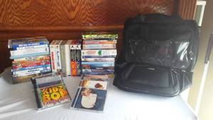 lot 97 image: DVDVHSCD assortment with Samsonite Carry Bag.