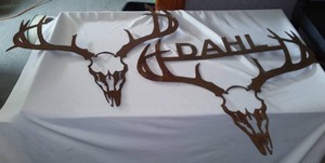 lot 195 image: Metal Art (2) 23 in. x 23 in. Easy to modify if your Family name is not Dahl.