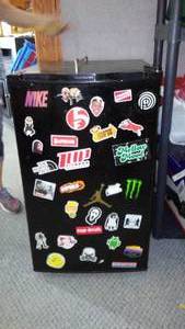 lot 202 image: Mini Fridge And Storage Cabinet. 20 in. W x 22D x 33 in. T. (fridge) 24 in. W x 10 D x 66 in. T (Cabinet)