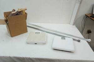 lot 110 image: Bathroom Scales, Large Tension Rods, & Wooden Hangers