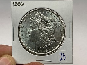 lot 23 image: 1886 Morgan Silver Dollar