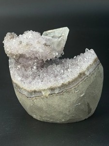 lot 10 image: A stunning Amethyst crystal perched on its natural matrix, featuring delicate Calcite inclusions that add depth and character. 1lb 15.6 oz.  0.896 kg.