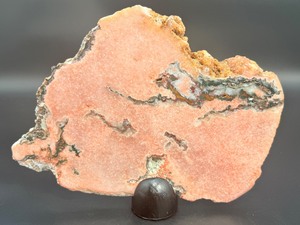 lot 14 image: A stunning extra-large pink amethyst slice, glowing with soft rosy hues and natural crystalline texture. 2 lbs 10.3 oz.  1.200 kg.