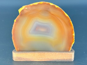 lot 17 image: Natural Polished front Agate on custom wooden stand from Brazil. 1 lb.  0.458 kg.