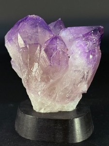 lot 33 image: An Elestial Amethyst Cluster is a rare and powerful crystal formation celebrated for its intricate, layered growth and deep spiritual energy. 1 lb 11.2oz.  0.772 kg