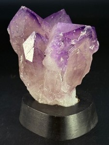 lot 33 image: An Elestial Amethyst Cluster is a rare and powerful crystal formation celebrated for its intricate, layered growth and deep spiritual energy. 1 lb 11.2oz.  0.772 kg
