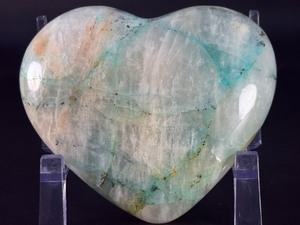 lot 40 image: Quantum Quattro Heart is a striking, multi-faceted crystal heart that combines four powerful stonestypically Clear Quartz, Amethyst, Smoky Quartz, and Citrineinto one harmonious piece. 1lb 4.4 oz.  0.580 kg.