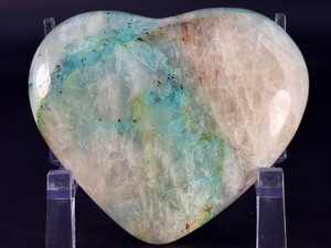 lot 40 image: Quantum Quattro Heart is a striking, multi-faceted crystal heart that combines four powerful stonestypically Clear Quartz, Amethyst, Smoky Quartz, and Citrineinto one harmonious piece. 1lb 4.4 oz.  0.580 kg.