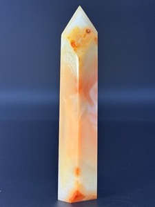 lot 42 image: Carnelian Flower Agate Tower is a stunning hand-carved crystal that combines the vibrant, energizing hues of carnelian with the earthy, patterned beauty of flower agate.1 lb 2.0 oz.  0.511 kg.