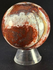 Laguna Lace Agate Sphere is a mesmerizing crystal sphere that highlights the intricate, lace-like banding unique to Laguna Agate.