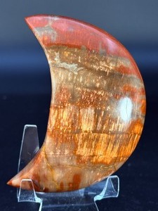 lot 49 image: Petrified Wood Moon is a beautifully carved piece that captures ancient earth energy in a graceful moon shape. 12.9 oz.  0.366 kg.